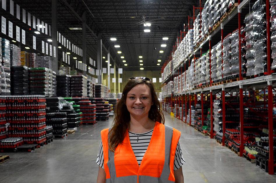Hannah poses for a picture at the Atlantic Bottling Company warehouse.