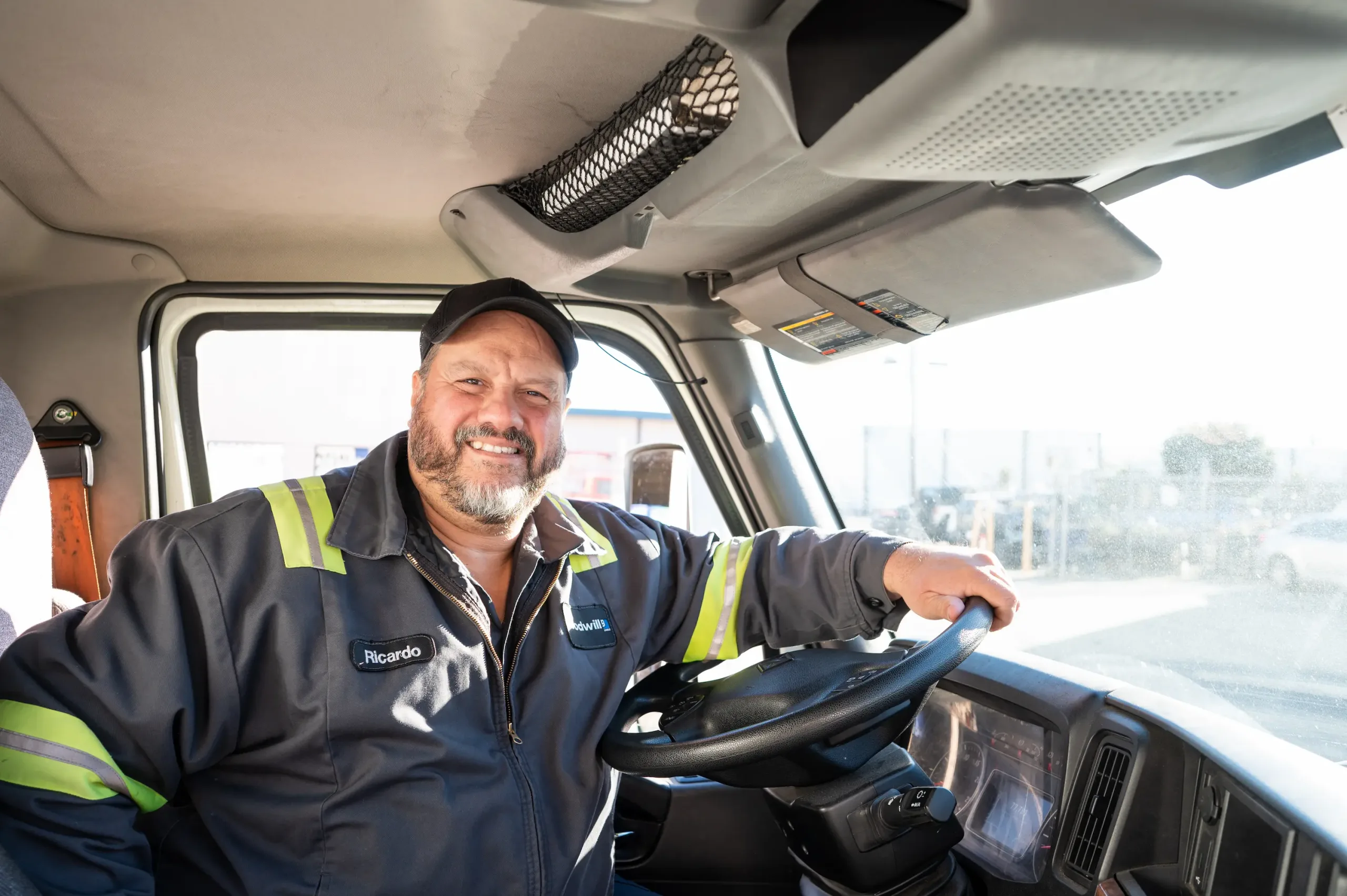 Sixth_20221103_GII_0635 driver smiling to camera behind the wheel